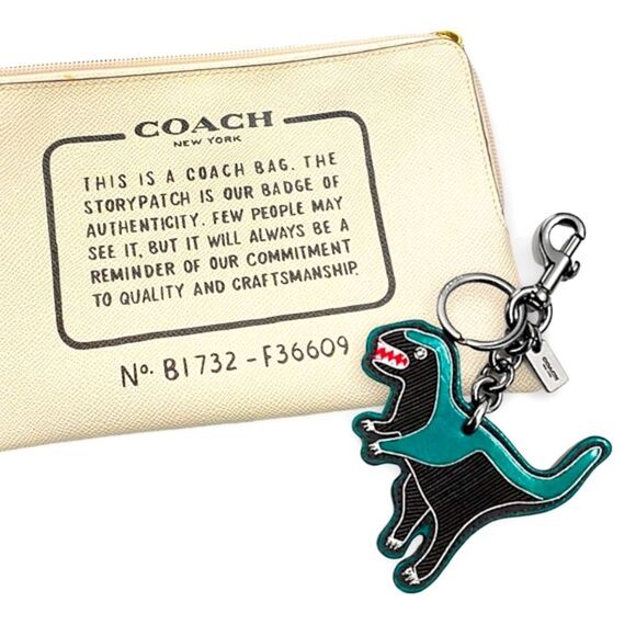 2/$150 Coach REXY Dinosaur Embroidered Keychain AND Coach Pebbled Leather Clutch - Picture 1 of 4